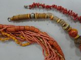 a necklace made of beads and beads on a table