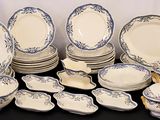 a lot of plates and bowls that are on a table