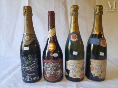 four bottles of wine are lined up on a table
