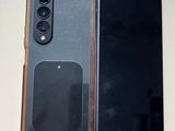 an image of a couple of cell phones sitting on top of a table