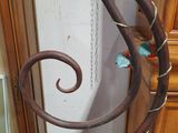 a metal sculpture with a spiral design on top of it