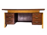 the desk is made of wood and has two drawers