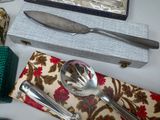 a table with silverware and napkins and silverware on it