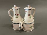 two white and blue vases with flowers on them
