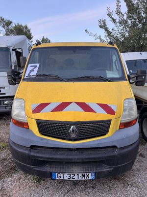 a yellow van that is parked in a parking lot
