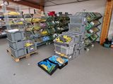 many bins of fruit and vegetables in the store