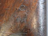a close up of a wooden object with holes in it