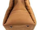 the inside of a tan purse with a zipper on it