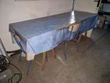 a table with a blue cloth on it in a room