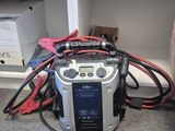 a radio that is sitting on the floor in front of a bookcase