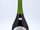 a bottle of wine that is sitting on a table