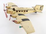 a toy airplane that is sitting on a white surface
