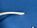 a close up of a pair of glasses on a blue surface