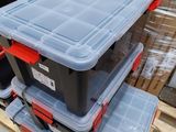 a stack of plastic containers sitting on top of a pallet