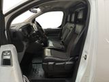 a white truck with black seats in the back of it