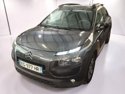 a black citrole parked in a white room