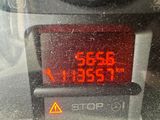 a close up of a car ' s dashboard with a stop button