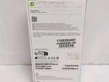 the back of a white box with a green label on it