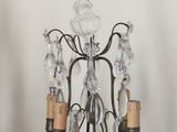 a chandelier that has a lot of glass hanging from it