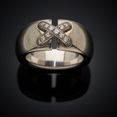 a close up of a ring with a cross on it