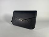 a black leather envelope bag with a metal clasp