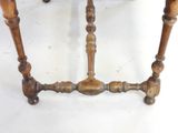 a small table with a wooden top and a wooden base