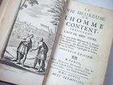 an old book with a picture of a man and a woman shaking hands
