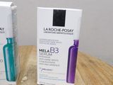 two boxes of la roche - posay melab 3 eye creams on a wooden table