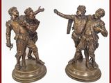 paire de figurines anciennes en bronze représentant un homme et une femme