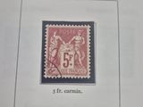 an old stamp with a picture of a man and woman on it