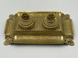 an antique brass inkwell with two inkwells on a tray