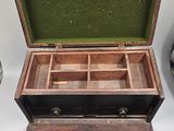 a small wooden box with compartments inside of it