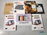 boxes of various electronics are sitting on a table in front of a laptop