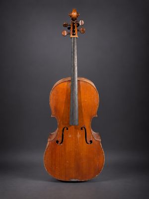 an old violin on a black background