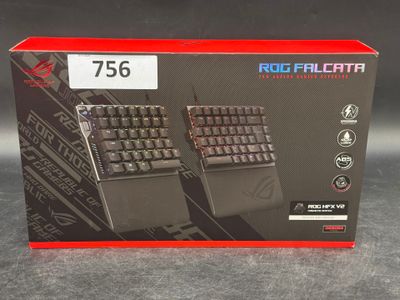 a box with two keyboards in it on a table