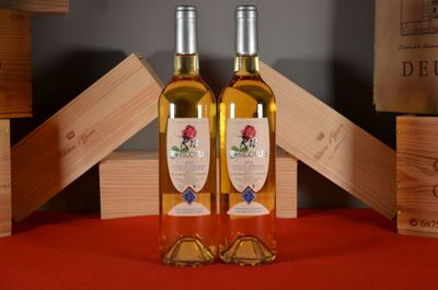 two bottles of wine sitting on a table next to each other
