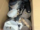 a cardboard box filled with assorted items on the floor