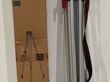 a box and a tripod on the floor next to a box