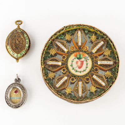 three pieces of jewelry including a clock, a locke, and a broochet