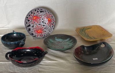 a lot of bowls and bowls on a table