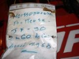 a piece of paper with writing on it hanging from a hook