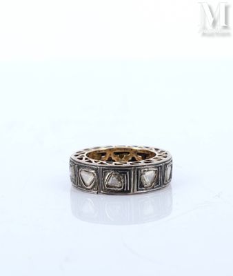 a close up of a ring on a table with a white background