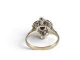 a close up of a ring with a flower design on it