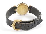 an image of a gold watch with a black leather strap