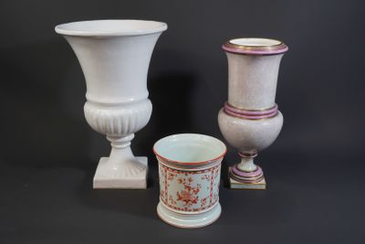 two vases sitting next to each other on a black background