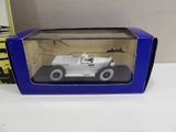 the box is open on the table with a toy car in it