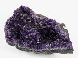 a close up of a piece of amethorate on a white surface