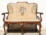 a wooden bench with a floral design on it