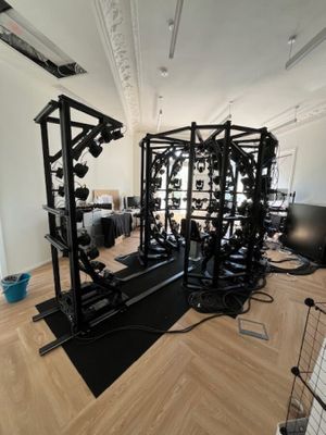 an image of a gym room with equipment on the floor