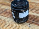 a close up of a camera lens sitting on a wooden table